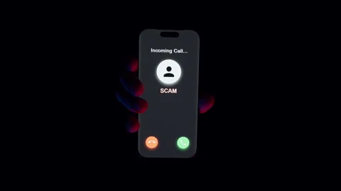 Hand Holds Smartphone with Scam Call Screen While User Presses Red Button to Stock Footage 319886399