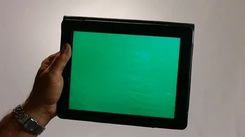HAND HOLDS A TABLET COMPUTER GREENSCREEN Stock Footage 12155096