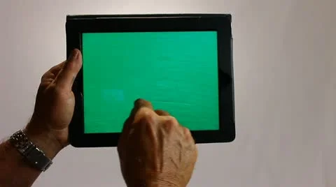 HAND HOLDS A TABLET COMPUTER GREENSCREEN 3 Stock-Footage 12159440