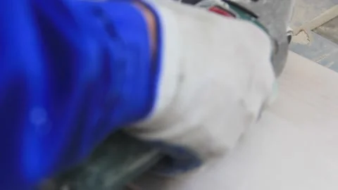 Hand holds the tile cutter tool and cuts the tile. Stock Footage 139586455