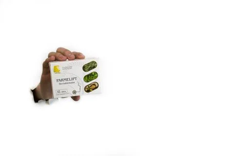 A hand holds on a white background at the pack of dietary supplements Kazakhstan Stock Photos