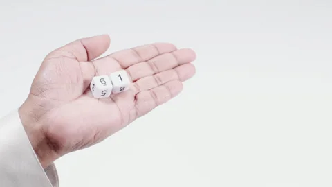 Hand Holds White Dice 6 and 1 numbers Stock Footage 248741967