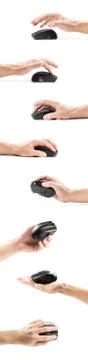 The hand holds a wireless black computer mouse. Close up. Isolated on a white Stockfoto's