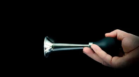 Hand honking on black background Stock Photos