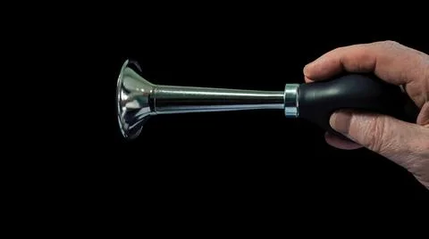 Hand honking on black background Stock Photos