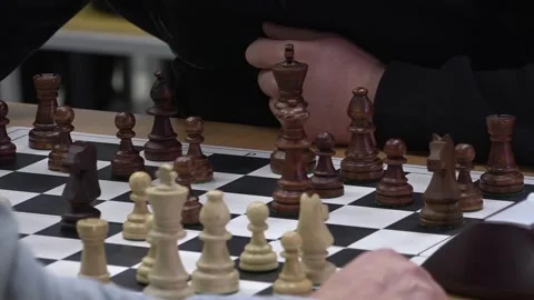 Hand hovering over chess pieces Stock-Footage 332807620