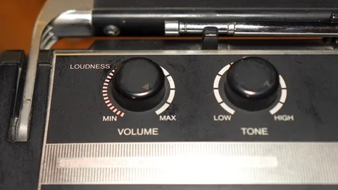 Hand of human is changing a volume of audio recorder by rotation of selector Video stock 111440658