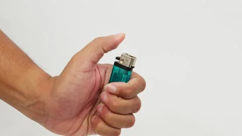 Hand Igniting a Gas Lighter Stock Footage 327849526