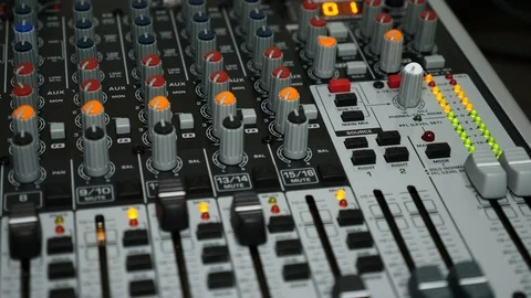 Hand Increasing Volume on Professional Audio Mixing Board 스톡 동영상 92781515