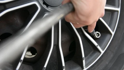 Hand inflates tires. Close up selective focus. Stock-Footage 115529024