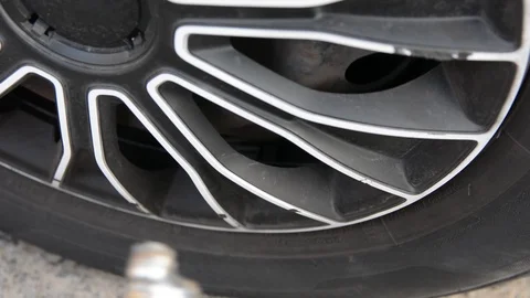 Hand inflates tires. Close up selective focus. Stockbeeldmateriaal 115529035