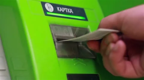 Hand insert and remove a credit card from an ATM Stock Footage 65404945