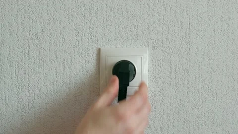 Hand Insert Plug Stock Footage 168864544