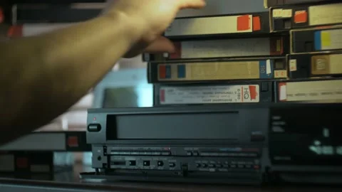 Hand inserted VHS into the VCR Stock Footage 88149946