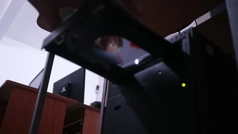 Hand inserting and ejecting a compact DVD disc into a optical disc drive. Stock Footage 344477214