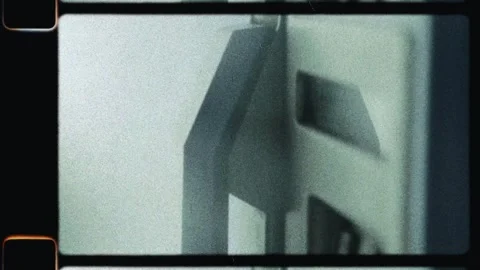 Hand inserting a film slide into projector carousel Stockbeeldmateriaal 345599719