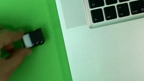 Hand Inserting Memory Card In Laptop, Green Screen, High Angle, Detail Video stock 73783234