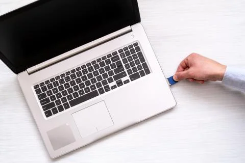 Hand inserting memory card Stock Photos