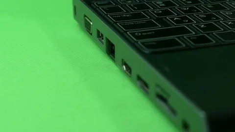 Hand Inserting Memory Stick Into Laptop, Green Screen Stock Footage 73782497