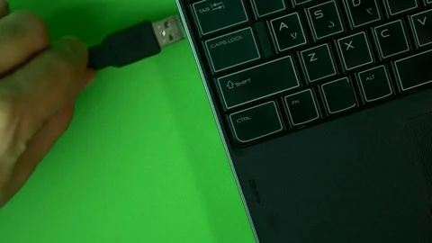 Hand Inserting USB Cable In Laptop, Green Screen Video stock 73782787