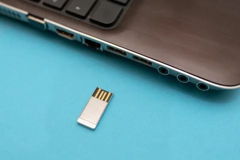 Hand inserting USB flash drive into computer laptop. Stock Photos