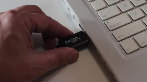 Hand inserting USB Video stock 51838571