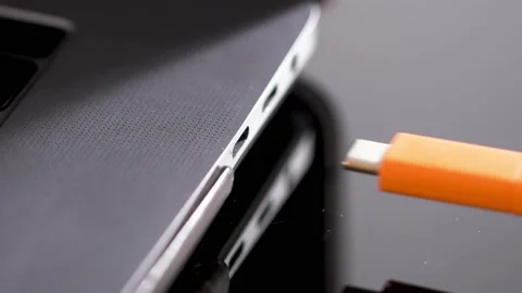 Hand inserting USB Type C wire into laptop computer. Fast Charging Type Stock Footage 150557315