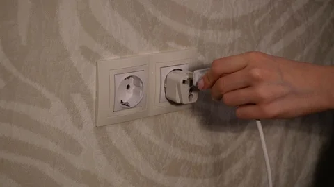 Hand inserts the adapter Video stock 120137605