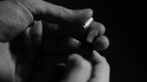 Hand inserts an ammo Stock Footage 40796678