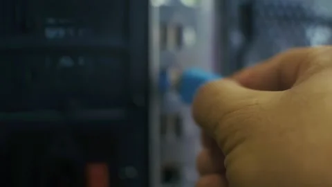 The hand inserts a blue flash drive Stock Footage 327952460