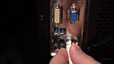 Hand inserts a lan wire into the computer. Video stock 151395727
