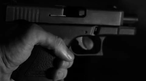 Hand inserts a mag into a gun Stock Footage 40796297