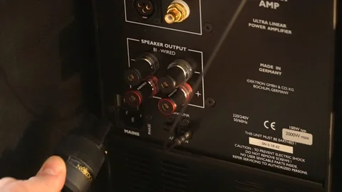 Hand inserts the plug into the music column . Stock Footage 92164852