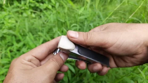 Hand Inspecting Rusty Metal Stapler Outdoors Video stock 310263786
