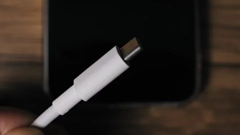 Hand Inspecting White USB-C Connector Closeup Stock Footage 320353935