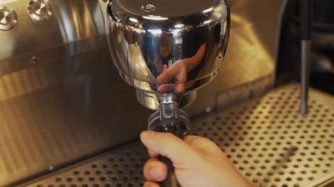 Hand install filter espresso handle to automatic machine. dirty coffee making in Stock Footage 159401589