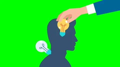 Hand installing light bulb on the human head. Businessman changes the lightbulb Stock Footage 276066502