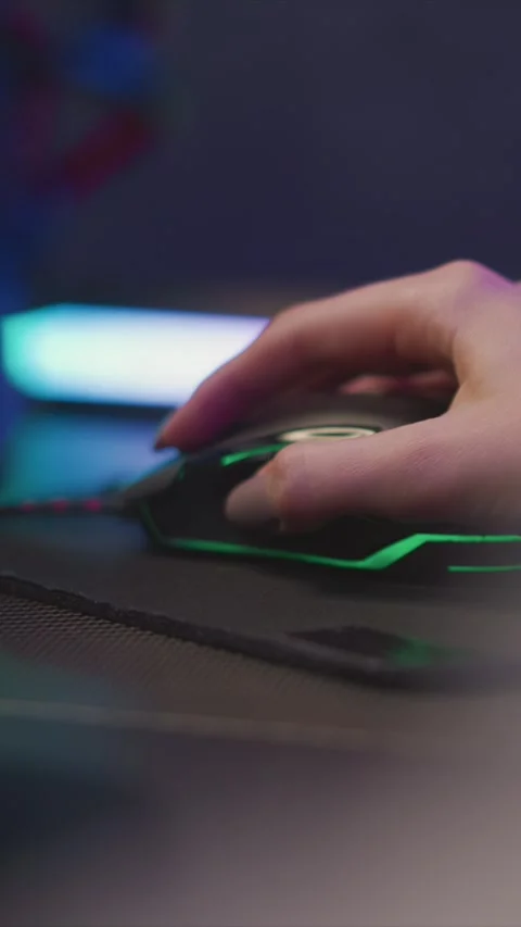 Hand interacting with gaming mouse in close up focusing on continuous movement Stock Footage 345976326