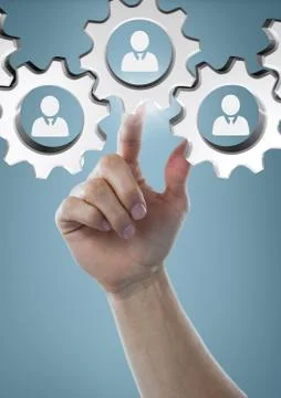 Hand interacting with people in cogs graphics against blue background Stock Photos