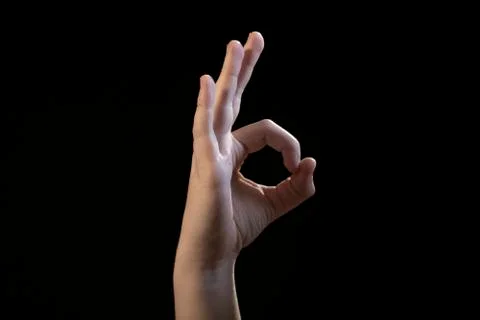 Hand isolated on black background look like ok Stock Photos