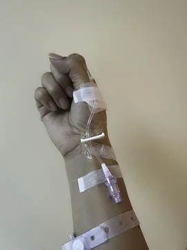 Hand with IV set,showing how to use the medical healing Stock Photos