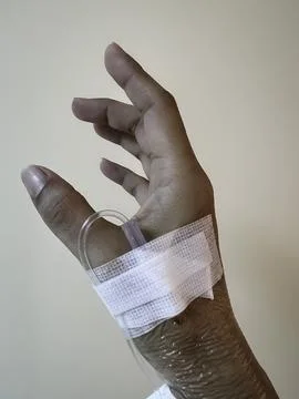 Hand with IV set,showing how to use the medical healing Stock Photos