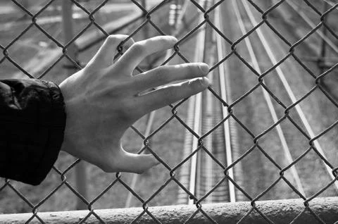 Hand is in jail dramatic negative shot Stock Photos
