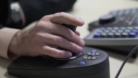 A hand with a joystick controls the surveillance camera Stock Footage 127354475