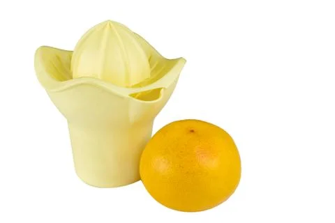 Hand juicer and grapefruit isolate on white. Stock Photos