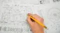 The hand keep pencil and work with blueprints engineering project Photo