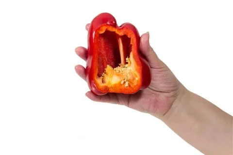 Hand keeps the cut red pepper Stock Photos