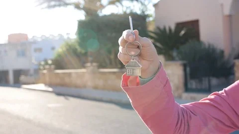 Hand with the key from the new house Stock Footage 73571934