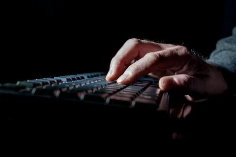 Hand on a keyboard Stock Photos