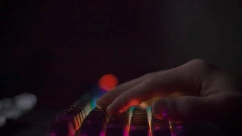 Hand on the keyboard, typing on the keyboard, working at the computer. Stock Photos